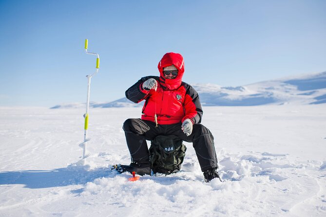 Arctic Fishing & Open Fire Cooking - Ice fishing basics: drilling holes and checking submerged nets