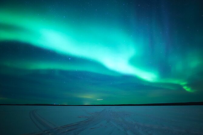 Chasing Aurora with Photographer - Small Group - Fireside break: Lappish sausages and hot drinks by the open fire
