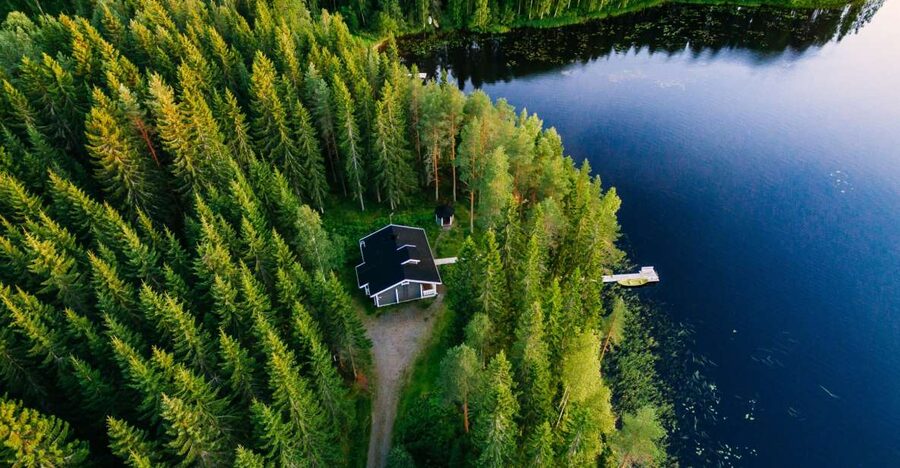 From Rovaniemi: Midnight Sun Forest Lake Float - Suit-up in the Arctic floating suit, with a hard 130 cm minimum