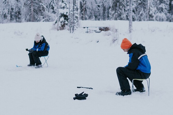 Ice Fishing by Snowmobile in Levi - The Warm Break: Sausages, Hot Drinks, and Guide Stories