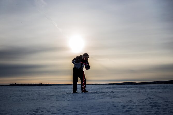 Ice Fishing on a Frozen Lake in Levi - Fire on the Ice: Snacks, Hot Drinks, and the Best Part of the Timing