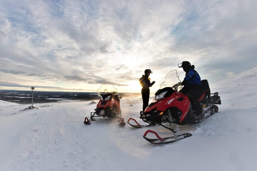 King of Ylläs: Snowmobiling to the Hill - The Hilltop Cafe Stop: Hot Drink, Doughnut, and Sweden-Edge Views