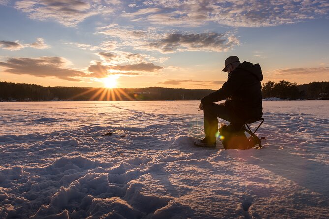 Lapland Ice Fishing Experience from Rovaniemi - Waiting in the cold, staying warm, and working the moment