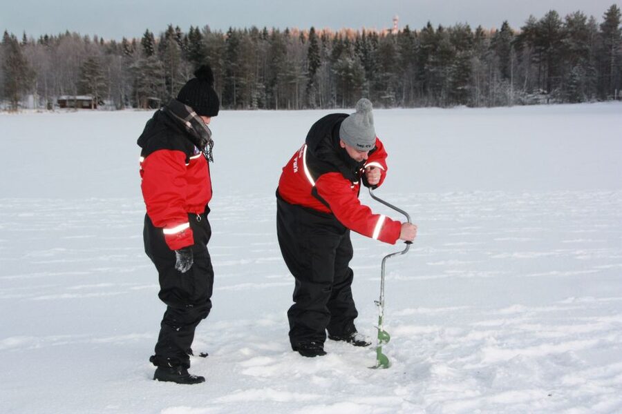 Rovaniemi: Arctic Circle Ice Fishing Experience - The Campfire Moment by the Frozen Lake, Hot Juice and Sausages