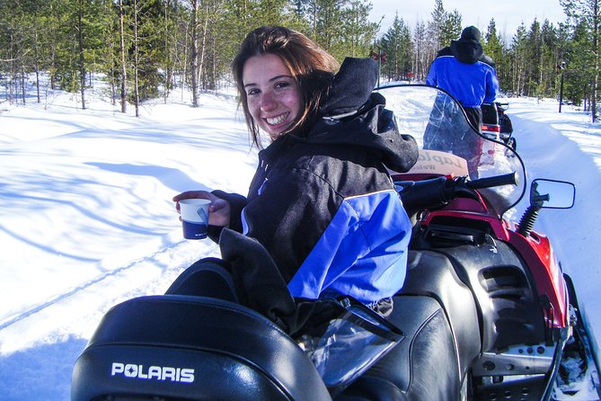 Snowmobile Safari in the Nature - Morning start - Warm pauses, snacks, and the tipi-style meal moment