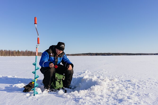 Snowmobiling and ice fishing in Apukka Resort, Rovaniemi - Ice Fishing on a Frozen Pond, With Real Warm-Up Support