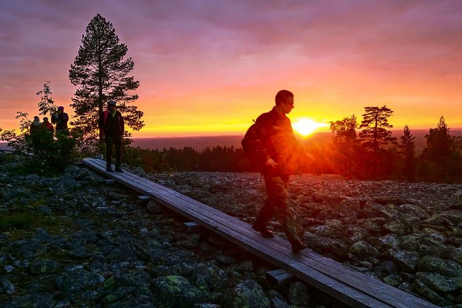 Sunset at the Arctic Circle - Katkavaara viewpoints: duck boards and a wooden tower