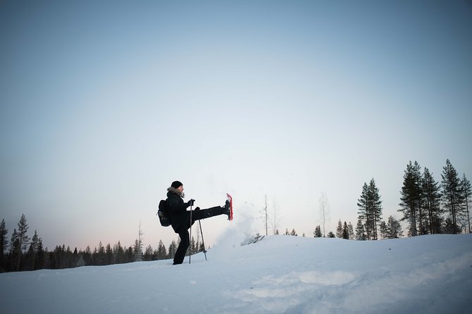 Wilderness snowshoe adventure - Campfire break in a wooden shelter: where the tour warms up